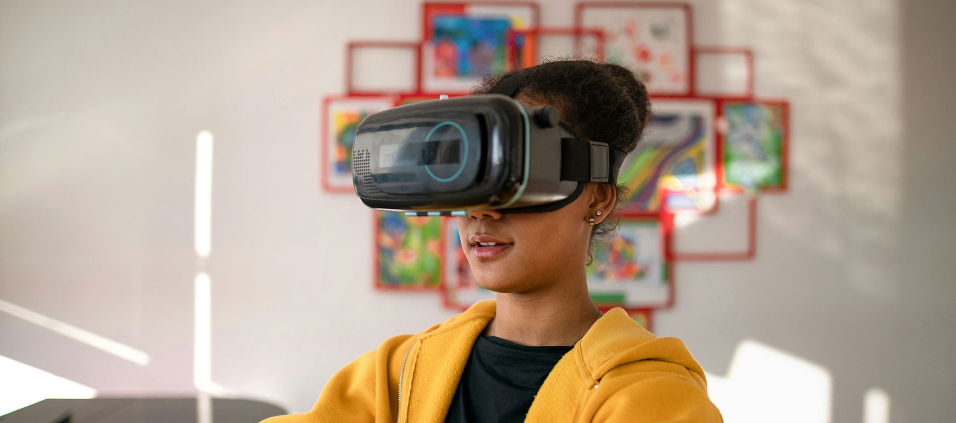 A young woman stood in a living room with a VR headset on and her arms outstretched.