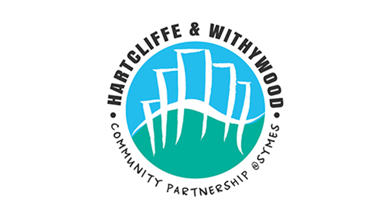Logo with abstract white buildings over green hills in a blue circle. Surrounding text: 